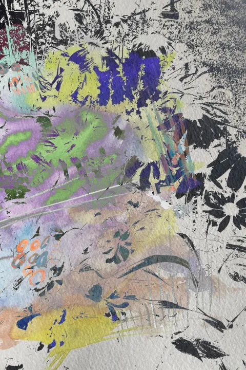 Violet flowers and gray-silver leaves in a shadowy garden